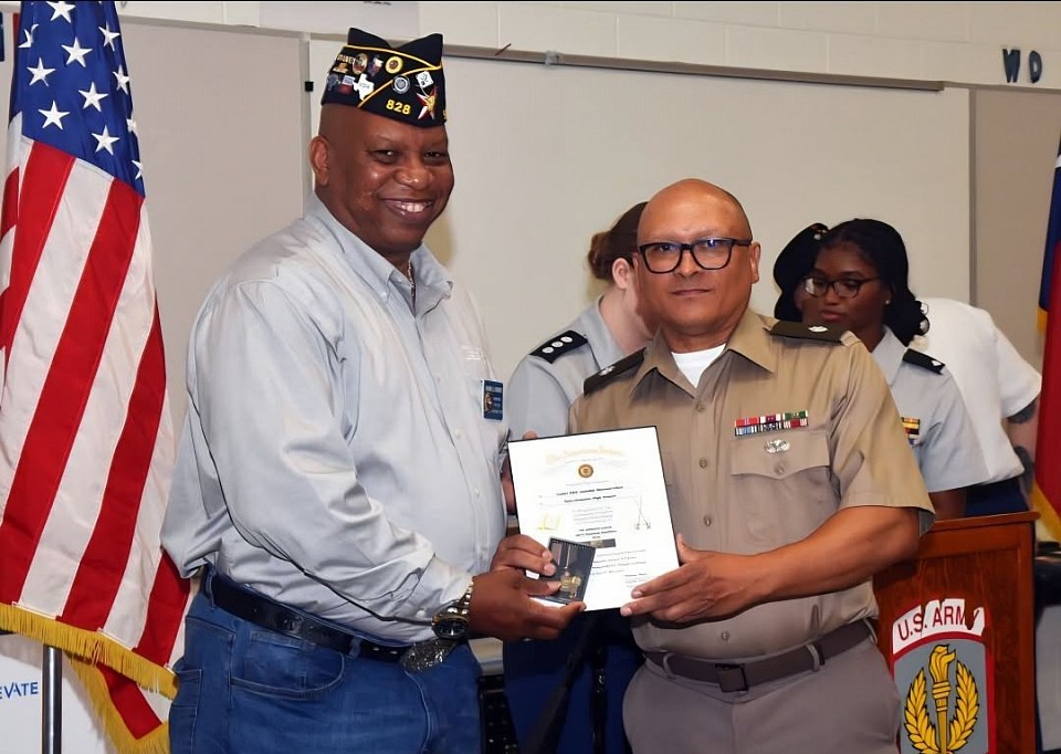 SAN ANTONIO - The American Legion is a strong supporter of Junior Reserve Officer Training Corps (JROTC) and ROTC programs across the country. On May 1, Post Commander Burrell Parmer attended Sam Houston High School’s JROTC Awards Ceremony presenting the Military Excellence Medal to Cadet Kalijah Henderson and the Scholastic Excellence Medal to Cadet Jennifer Monzon-Chun.  (Photos by Tesha Parmer)